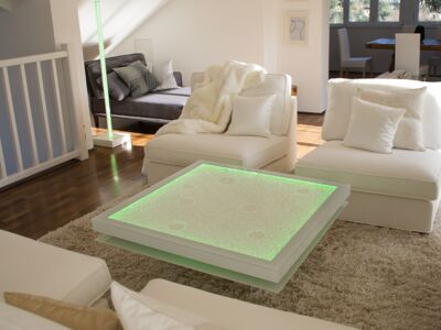 Glaszone Glass Table Shine with white enamel frame and green RGB-lighting